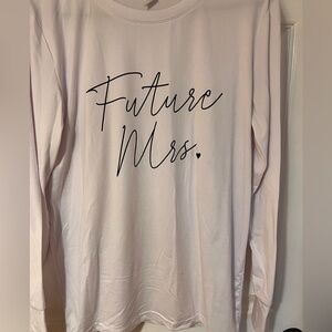 White long sleeve tshirt “Future Mrs” with “I said yes” near the cuff.